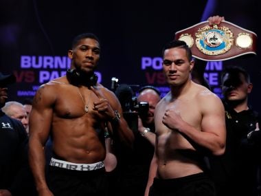 Anthony Joshua (L) and Joseph Parker at weigh-in on Friday. Reuters