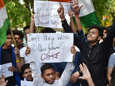 Students raise slogans against CBSE paper leak in New Delhi on Friday. PTI