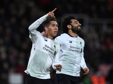 File photo of Liverpool's Roberto Firmino and Mohamed Salah. Reuters