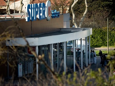 French Police officers and emergency service members work at the supermarket in Trebes. AP