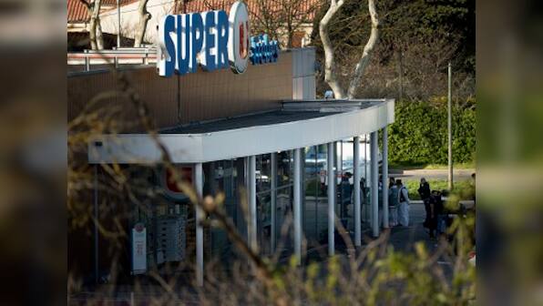 France to pay national tribute to police officer who offered himself for hostage during attack at supermarket