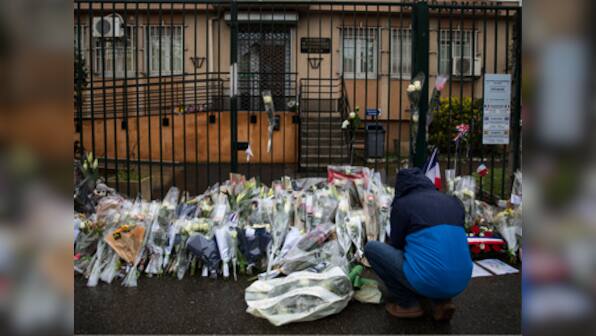 France supermarket attack: Mourners pay tribute to victims; Emmanuel Macron to meet security officials this week