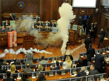 Kosovo opposition politicians release tear gas in parliament to obstruct a session. Reuters