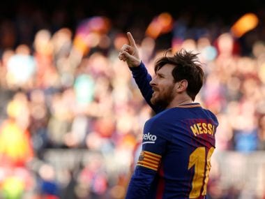 Barcelonas Lionel Messi celebrates scoring their second goal. REUTERS