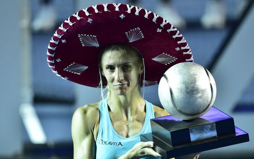 Lesia Tsurenko poses with the trophy after winning the Mexican Open WTA final. AFP