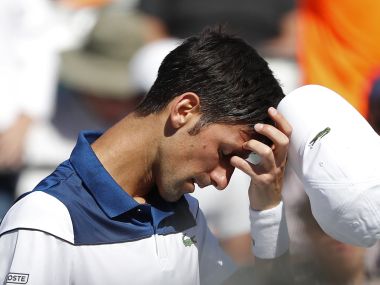 Novak Djokovic reacts after losing a game to Benoit Paire. Reuters