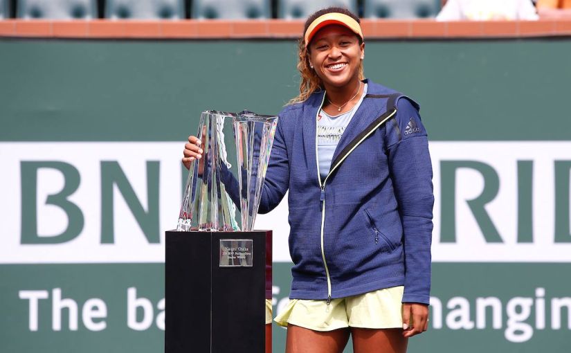Naomi Osaka poses with the Indian Wells trophy after winning the final against Daria Kasatkina. Image courtesy: Twitter @BNPParibasOpen