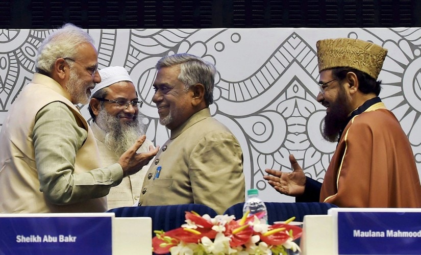 Prime Minister Narendra Modi interacts with Islamic scholar Akhtarul Wasey, Maulana Mahmood Madani and Shahi Imam Mufti Mukarram (right) of Fatehpuri Mosque at the conference on "Islamic Heritage: Promoting Understanding and Moderation". PTI