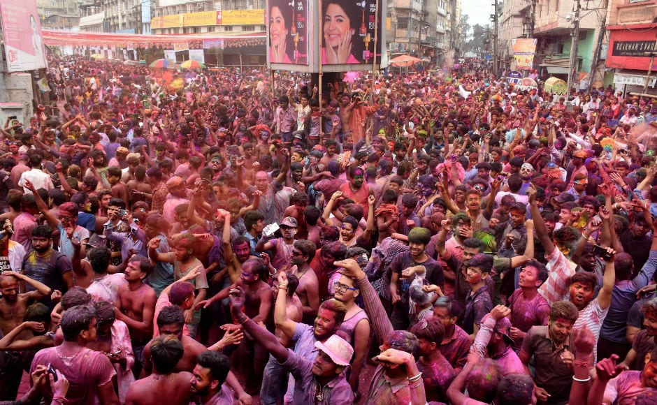 Hundreds of people celebrating Holi in West Bengal's Kolkata town. Children and elders sprayed colour and gulal on each other and later offered sweets. PTI Hundreds of people celebrating Holi in West Bengal's Kolkata town. Children and elders sprayed colour and gulal on each other and later offered sweets. PTI