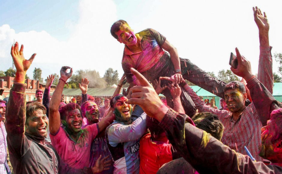 Border Security Force soldiers, with faces smeared with colour, dance during Holi celebrations in a camp in Humhama on the outskirts of Srinagar. Holi which marks the end of winters and emergence of the spring, sees the year coming full circle. PTI Border Security Force soldiers, with faces smeared with colour, dance during Holi celebrations in a camp in Humhama on the outskirts of Srinagar. Holi which marks the end of winters and emergence of the spring, sees the year coming full circle. PTI