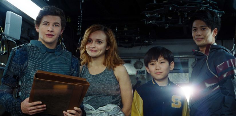 This cover image released by Warner Bros. Pictures shows Tye Sheridan, from left, Olivia Cooke, Philip Zhao and Win Morisaki in a scene from "Ready Player One." (Warner Bros. Pictures via AP)