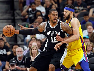 Mar 19, 2018; San Antonio, TX, USA; San Antonio Spurs power forward LaMarcus Aldridge (12) posts up against Golden State Warriors center JaVale McGee (right) during the second half at AT&T Center. Mandatory Credit: Soobum Im-USA TODAY Sports - 10720956