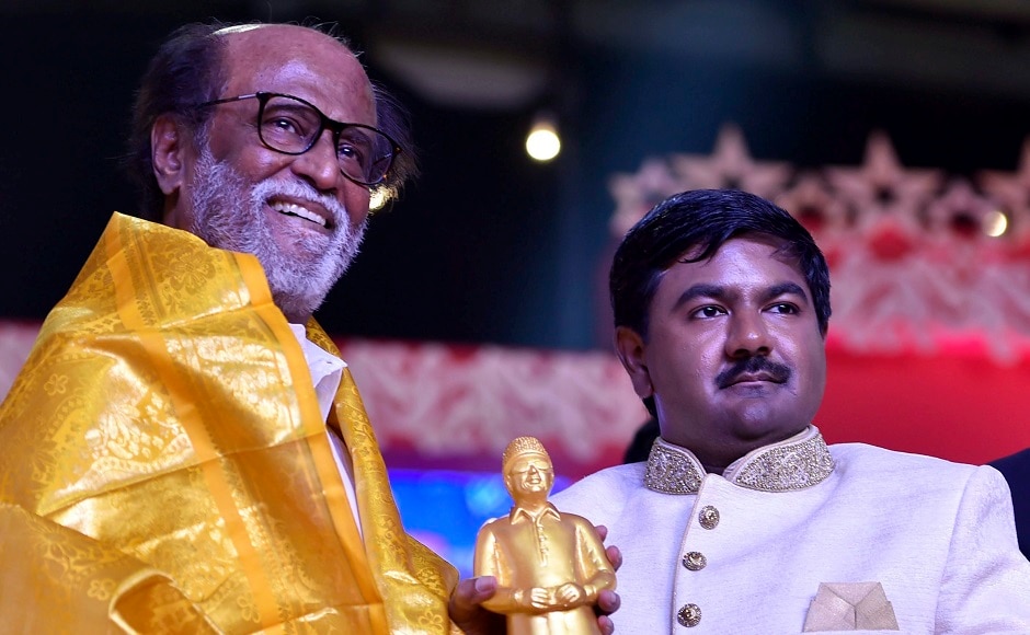 Rajinikanth received a memento after unveiling the statue. He also gave away awards to some students on the occasion. PTI Rajinikanth received a memento after unveiling the statue. He also gave away awards to some students on the occasion. PTI