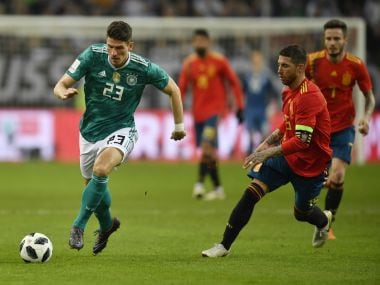 Germany's Mario Gomez runs for the ball beside Spain's Sergio Ramos, right, during their international friendly in Duesseldorf, Germany. AP