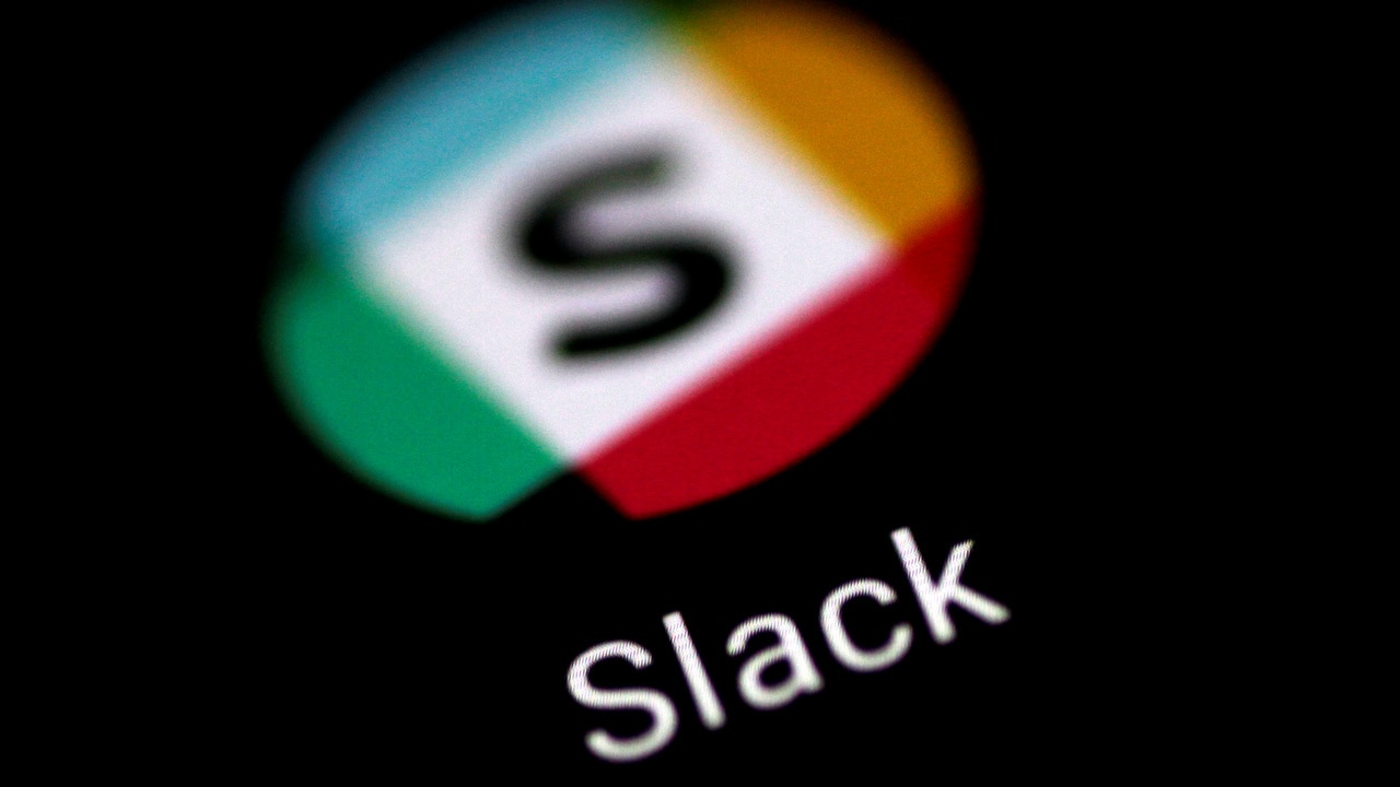 The Slack messaging application is seen on a phone screen August 3, 2017. REUTERS/Thomas White - RC172D5A2AC0
