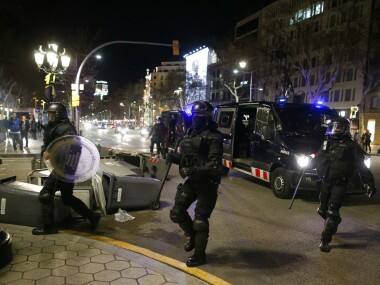 Spain unrest: Clashes erupt between Catalan separatists, police after Carles Puigdemont's arrest in Germany