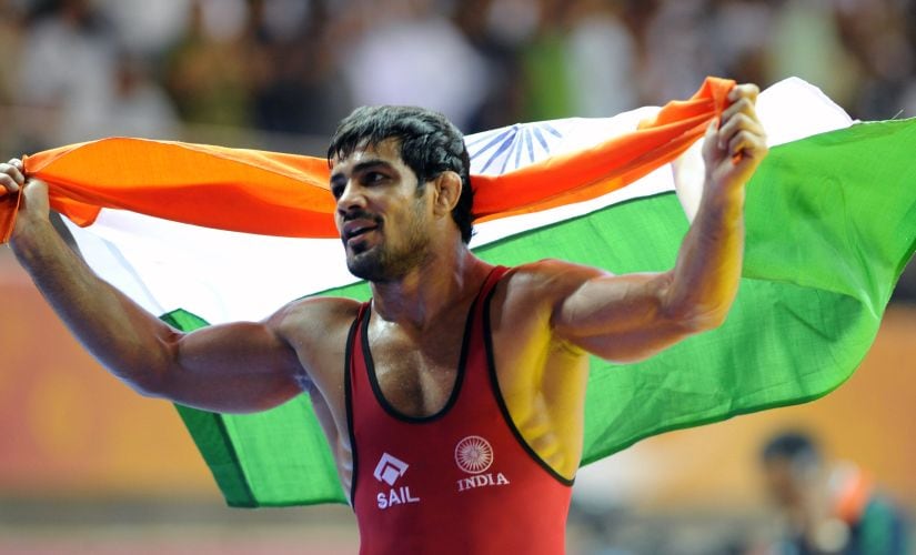 Sushil Kumar celebrates after winning the gold at 2010 Commonwealth Games in New Delhi. AFP