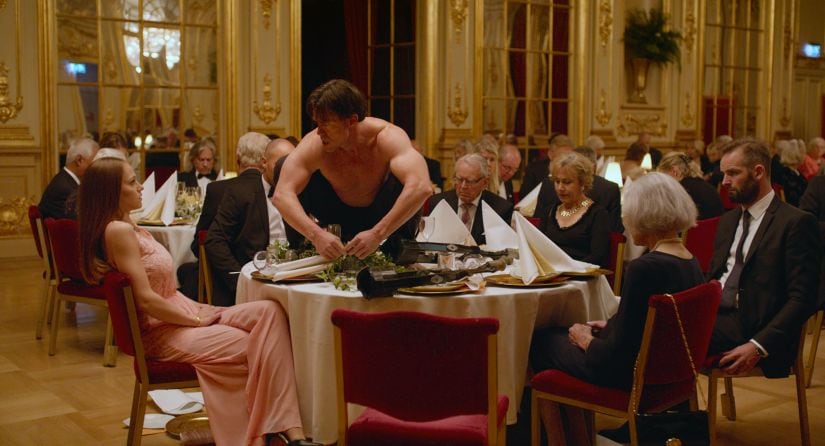 File- This image released by Magnolia Pictures shows Terry Notary, center, in a scene from "The Square." Best Foreign Language Film. Will Win: The biggest conversation-starter of the bunch is Ruben Ostlund’s “The Square,” which I believe will work to its benefit in a crowded field of worthy and interesting films. Also, it has the benefit of that must-see banquet scene with Notary. (Magnolia Pictures via AP, File)