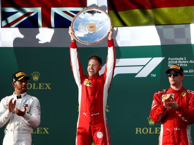 Sebastian Vettel celebrates his win on the podium with Lewis Hamilton and Kimi Raikkonen. Reuters