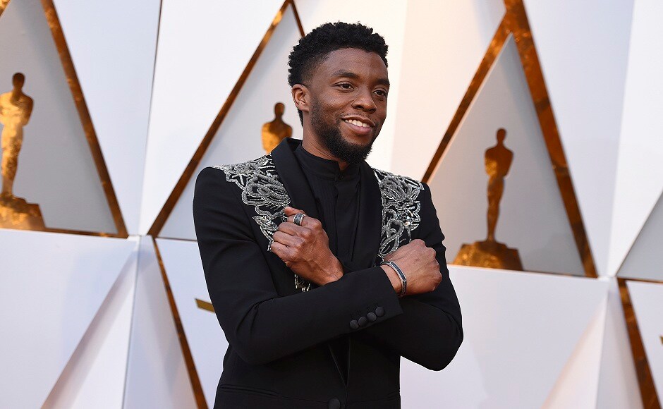 Chadwick Boseman chanelled t'challa at the Oscars, winning fans with his Givenchy topcoat and 'Wakanda Forever' war cry . AP Photo