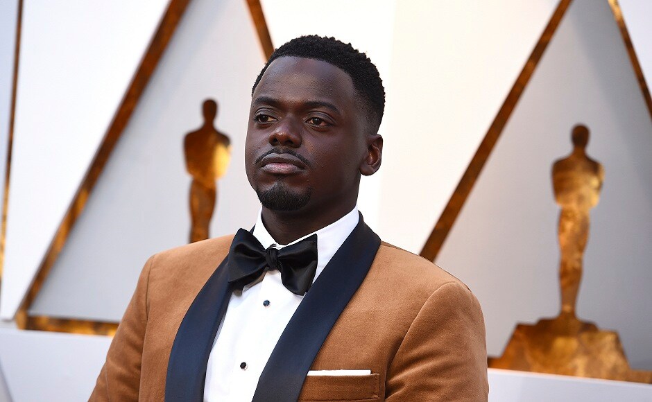 Get Out star Daniel Kaluuya's bronze Brunello Cucinelli jacket was a perfect match for the Oscar statuette. AP Photo