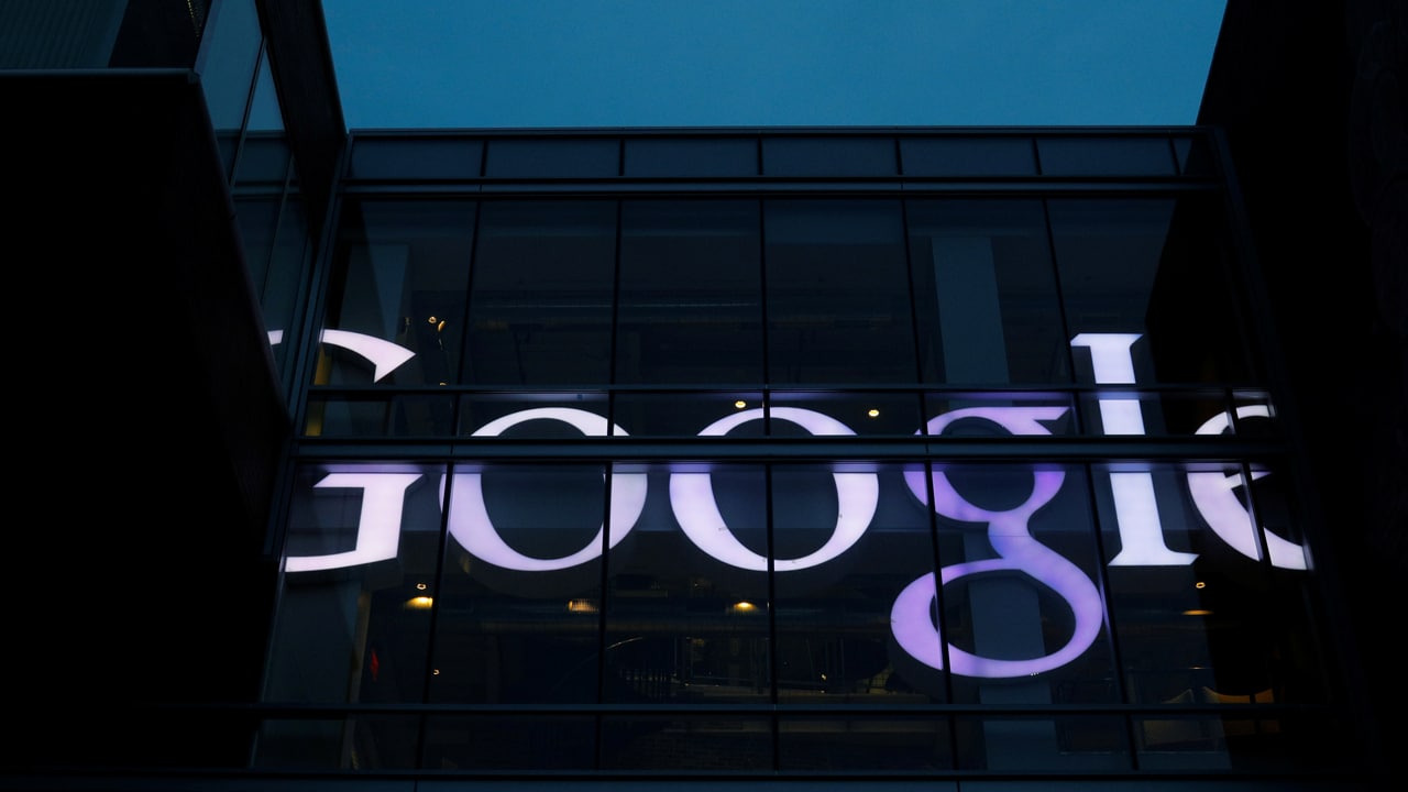 The sign marking the Google offices is lit up in Cambridge. Image: Reuters