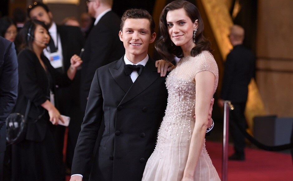US actress Allison Williams (R) and British actor Tom Holland pose as they arrive for the 90th Annual Academy Awards on March 4, 2018, in Hollywood, California. / AFP PHOTO / ANGELA WEISS