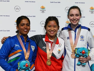L-R: India's Tejaswini Sawant, Singapore's Martina Lindsay Veloso and Scotland's Seonaid McIntosh pose during the medal ceremony for the women's 50m rifle prone shooting final during the 2018 Gold Coast Commonwealth Games at the Belmont Shooting Complex in Brisbane on April 12, 2018. / AFP PHOTO / Patrick HAMILTON