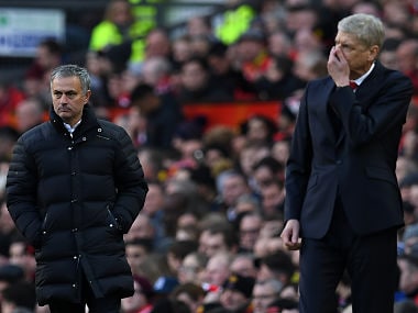 Manchester United's Portuguese manager Jose Mourinho (L) and Arsenal's French manager Arsene Wenger react as they watch their players from the touchline during the English Premier League football match between Manchester United and Arsenal at Old Trafford in Manchester, north west England, on November 19, 2016. / AFP PHOTO / Paul ELLIS / RESTRICTED TO EDITORIAL USE. No use with unauthorized audio, video, data, fixture lists, club/league logos or 'live' services. Online in-match use limited to 75 images, no video emulation. No use in betting, games or single club/league/player publications. /