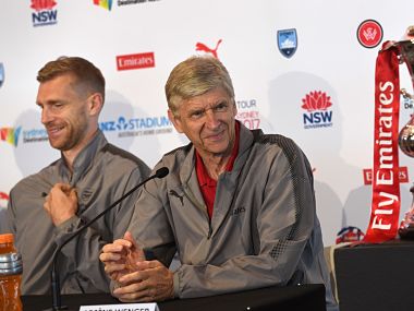 Arsenal football manager Arsene Wenger (R) and player Per Mertesacker (L) listen to a question during a press conference on July 11, 2017, ahead of two pre-season football friendly matches against Sydney FC on July 13 and Western Sydney Wanderers on July 15. / AFP PHOTO / WILLIAM WEST