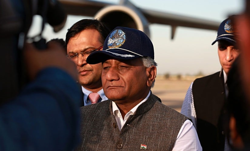 Pradeep Singh Rajpurohit, right, India’s Ambassador to Iraq, watches while a casket holding one of 38 Indians abducted and killed by the Islamic State is loaded on a truck. AP