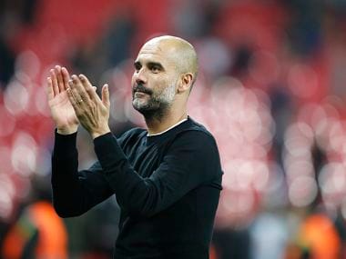 Manchester City manager Pep Guardiola applauds the fans as he walks from the pitch after the end of the English Premier League soccer match between Tottenham Hotspur and Manchester City at Wembley stadium in London, England, Saturday, April 14, 2018. (AP Photo/Frank Augstein)