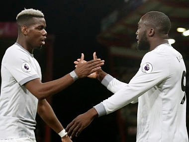 Manchester United's Romelu Lukaku, right, celebrates scoring his side's first goal of the game with teammate Paul Pogba, during the English Premier League soccer match between Bournemouth and Manchester United, at the Vitality Stadium, in Bournemouth, England, Wednesday April 18, 2018. (Adam Davy/PA via AP)