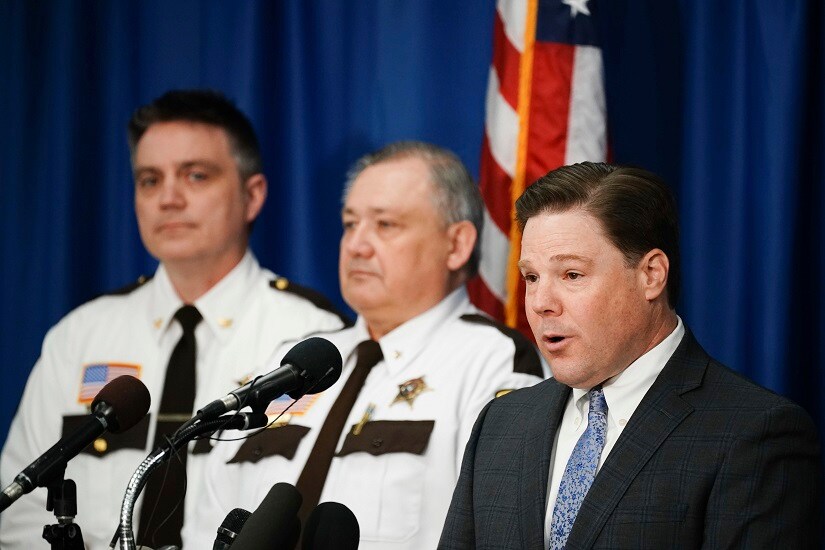 Carver County Attorney Mark Metz, right, announces at a press conference Thursday, April 19, 2018 in Chaska, Minn., that no criminal charges will be filed in the death of musician Prince in 2016. The decision effectively ends the state's two-year investigation into how Prince got the fentanyl that killed him. On the left are Chief Deputy Jason Kamerud and Carver County Sheriff Jim Olson. (Glen Stubbe /Star Tribune via AP)