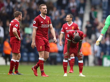 Liverpool's Jordan Henderson and teammates react, after the English Premier League soccer match between West Bromwich Albion and Liverpool, at The Hawthorns, West Bromwich, England, Saturday April 21, 2018. (Nigel French/PA via AP)