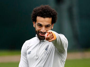 Liverpool's Mohamed Salah smiles during a training session at Melwood Training Ground, Liverpool, Britain, Monday, April 23, 2018, on the eve of their Champions League semifinal with AS Roma. (Martin Rickett/PA via AP)