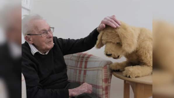 Robotic dog Biscuit lends helping paw to dementia patients in British care home, helps spark memories