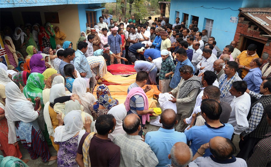 Relatives and family members gather around the bodies of the victims during a funeral in Khuwara village near Nurpur in Kangra district on Tuesday. PTI Relatives and family members gather around the bodies of the victims during a funeral in Khuwara village near Nurpur in Kangra district on Tuesday. PTI