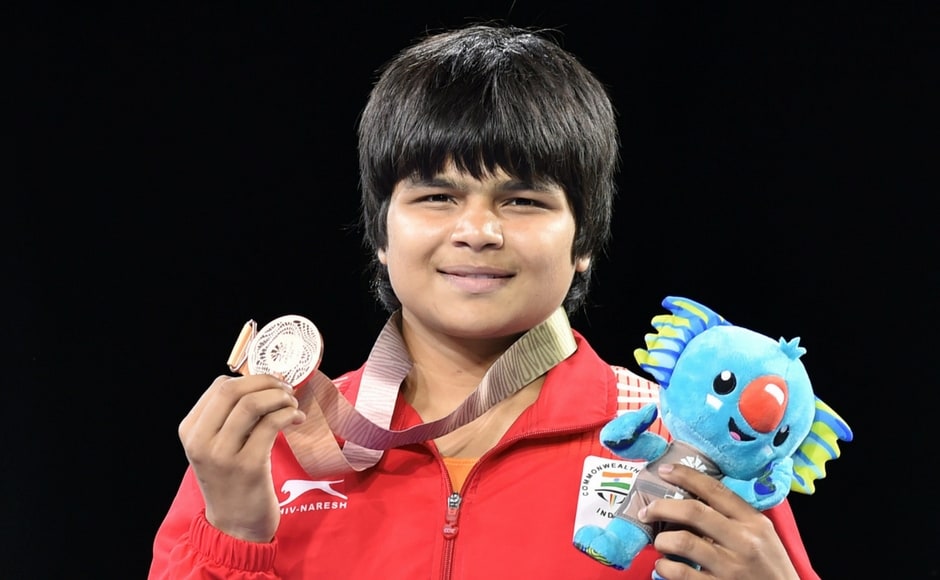 Bronze medal winner India's Divya Kakran at the medal ceremony of the women's freestyle 68 kg wrestling event. This was Divya's debut at CWG. PTI Bronze medal winner India's Divya Kakran at the medal ceremony of the women's freestyle 68 kg wrestling event. This was Divya's debut at CWG. PTI