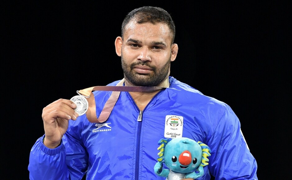 Silver medal winner India's Mausam Khatri at the medal ceremony of the men's freestyle 97 kg wrestling event. Mausam lost to Martin Erasmus of outh AFrica in the final PTI Silver medal winner India's Mausam Khatri at the medal ceremony of the men's freestyle 97 kg wrestling event. Mausam lost to Martin Erasmus of outh AFrica in the final PTI