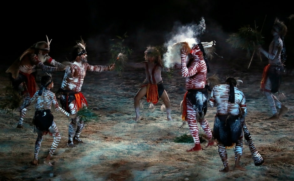 In a display of the indigenous culture of Australia, an aboriginal tribe perform the 'smoking ceremony' that is believed to have cleansing properties and wards off bad spirits. Reuters