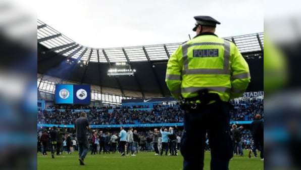Premier League: Pep Guardiola defends Manchester City fans' 'happy' pitch invasion after win over Swansea at Etihad