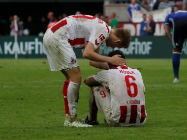 Cologne's Marco Hoger looks dejected after the match. Reuters