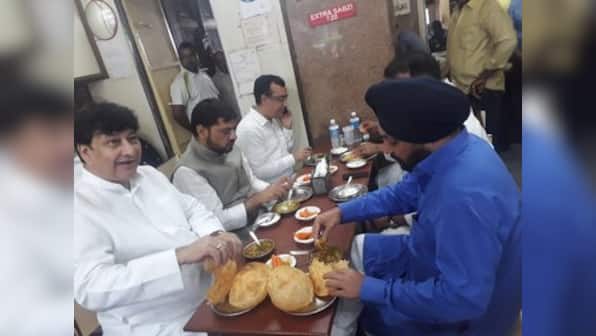 Congress leaders seen feasting before Rajghat fast; Sambit Patra terms Rahul Gandhi-led event 'farce'