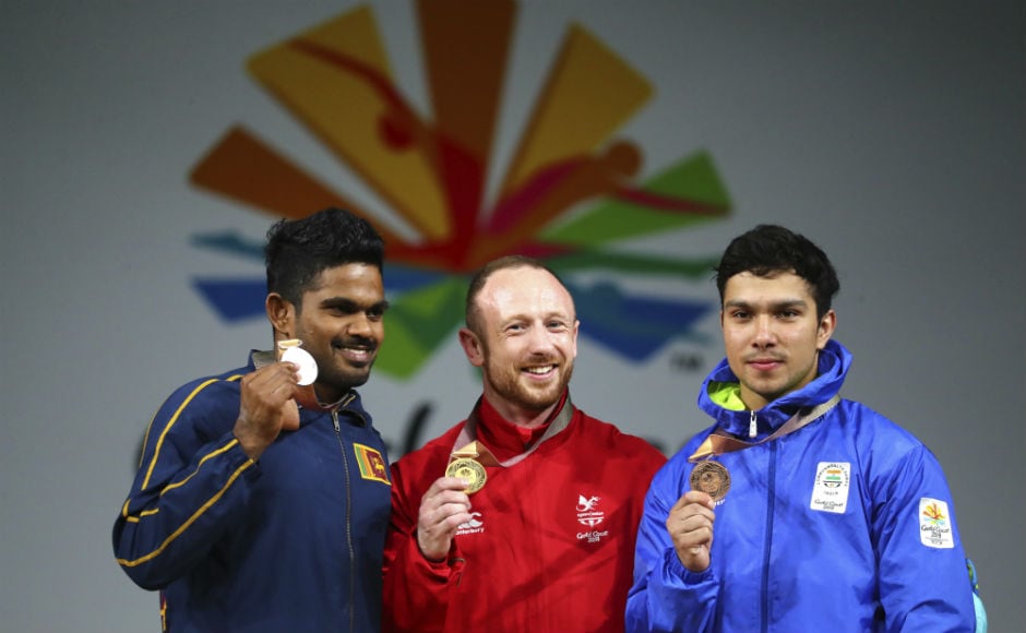 Wales's men's 69Kg weightlifting gold medalist Gareth Evans, centre, with Sri Lanka's silver medalist Mudiyanselage Dissanayake, left, and India's bronze medalist Deepak Lather pose after the medal ceremony at the Commonwealth Games. AP Wales's men's 69Kg weightlifting gold medalist Gareth Evans, centre, with Sri Lanka's silver medalist Mudiyanselage Dissanayake, left, and India's bronze medalist Deepak Lather pose after the medal ceremony at the Commonwealth Games. AP