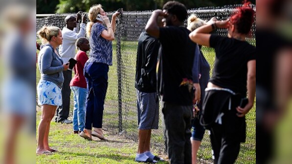 19-year-old former student carries gun in guitar case to Florida school, fires at closed door; 1 injured