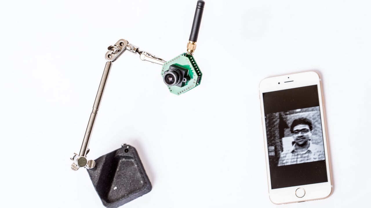 The UW team also created a low-resolution, low-power security camera, shown here on a stand. It can stream at 13 frames per second to another device, such as a smartphone.Image Credit: Dennis Wise/University of Washington