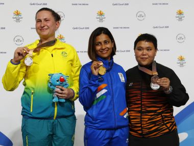 Gold medallist Heena Sidhu, silver medalist Elena Galiabovitch of Australia (L) and bronze medalist Alia Sazana Azahari of Malaysia on the podium after the 25m pistol event. Reuters