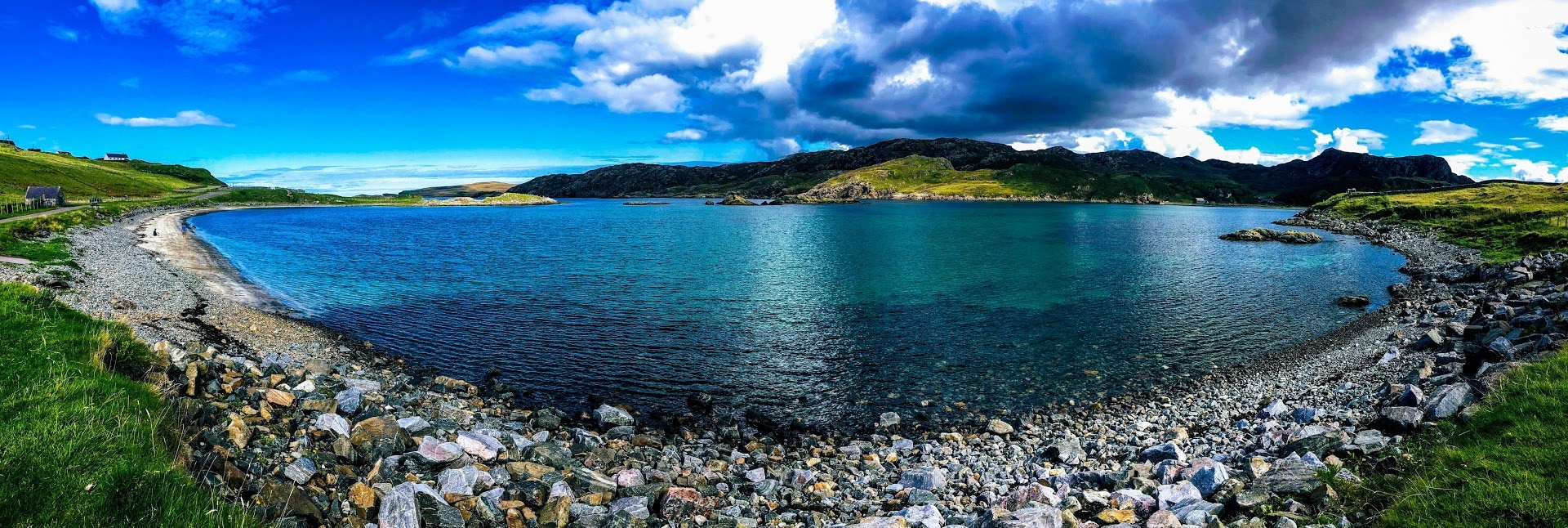 A panoramic view of the crystal clear water at Scourie Beach.