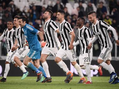 Juventus players celebrate their win over AC Milan on Saturday. AFP